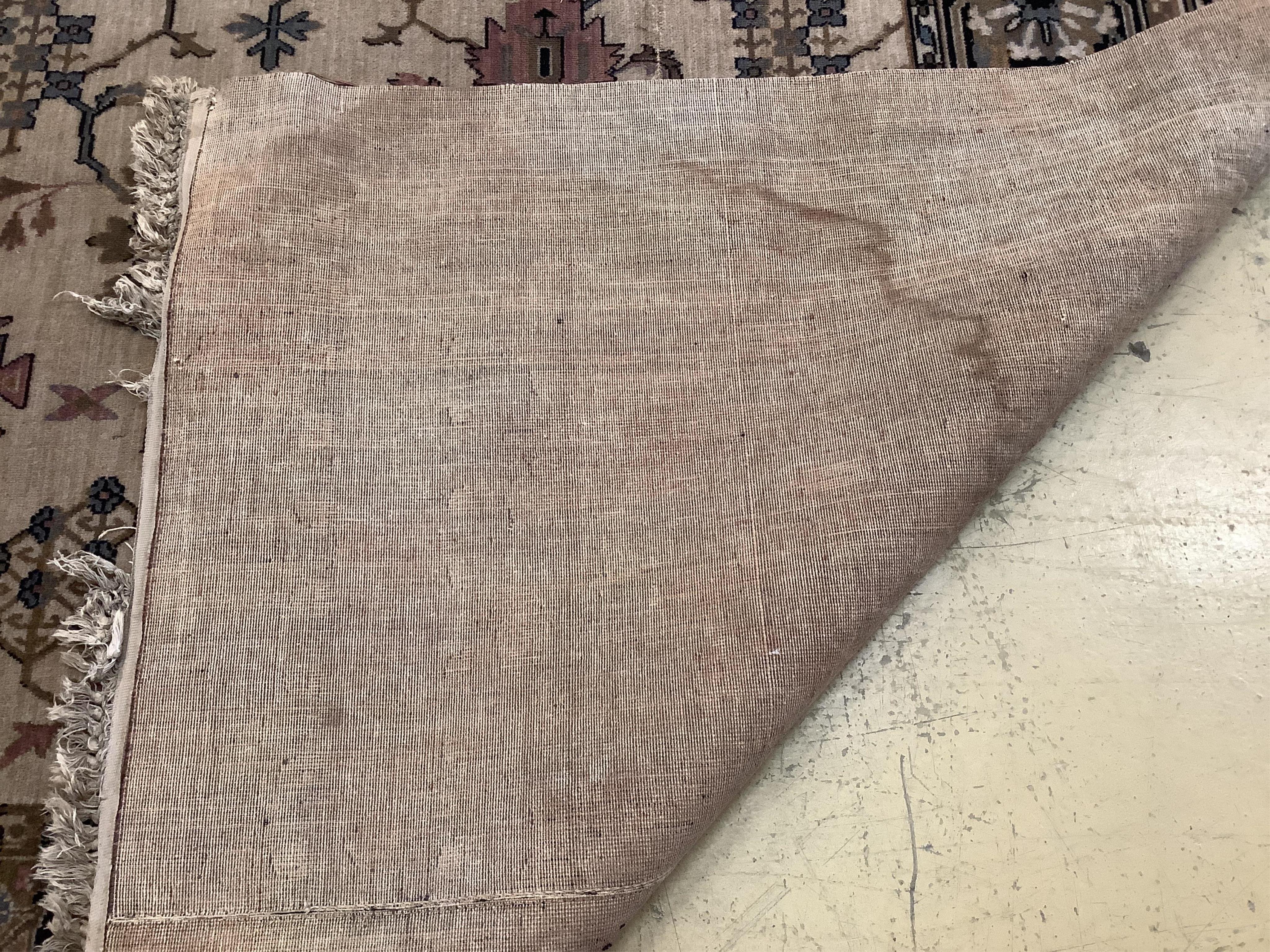 A Hamadan ivory ground carpet, 325 x 205cm